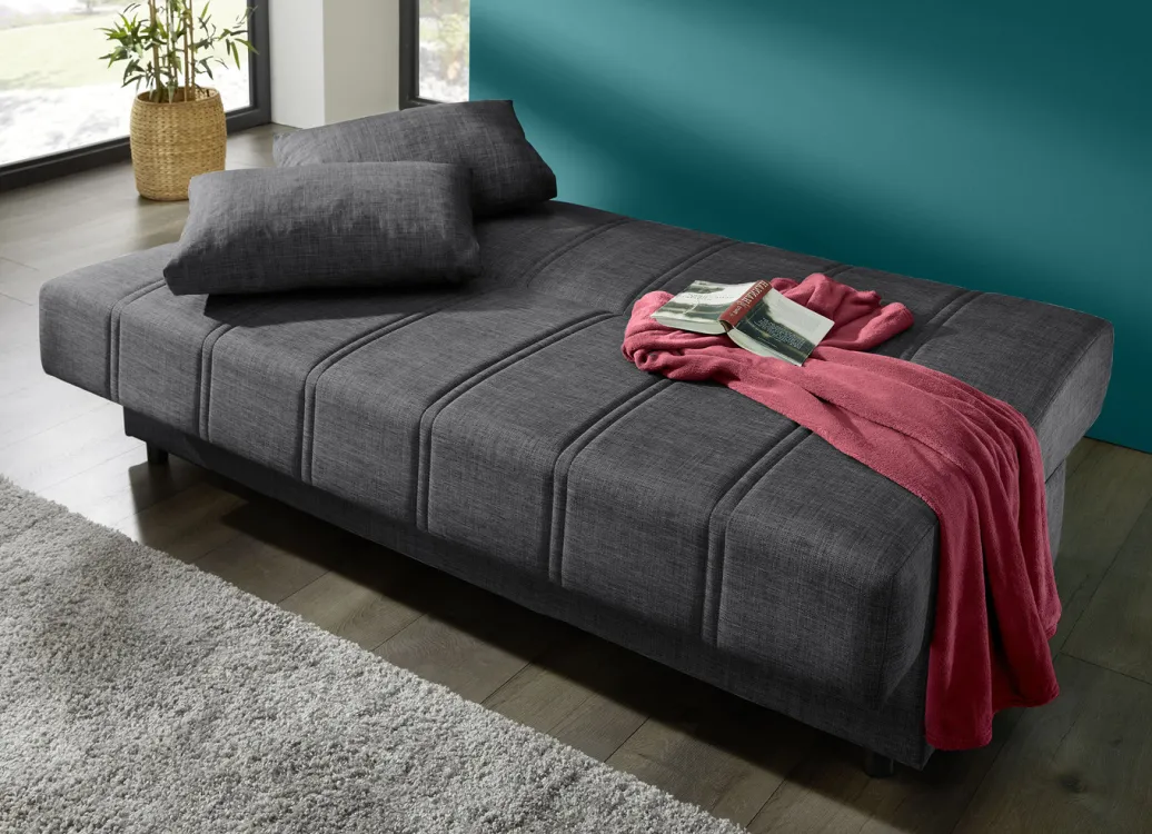 Möbel>Frei im Raum aufstellbares Schlafsofa mit Dekokissen und Bettkasten
