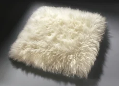 Heimtextilien></noscript>Merino-Lammfell-Sitzauflage in Tierform