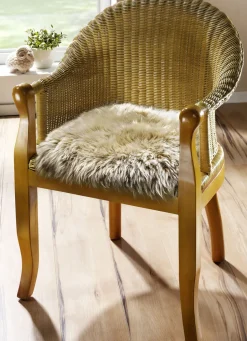 Heimtextilien></noscript>Merino-Lammfell-Sitzauflage in Tierform