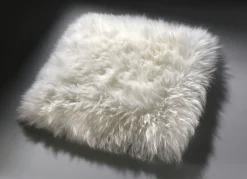 Heimtextilien></noscript>Merino-Lammfell-Sitzauflage in Tierform