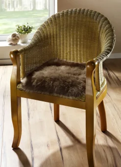 Heimtextilien></noscript>Merino-Lammfell-Sitzauflage in Tierform